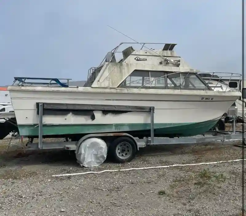 Deteriorated or abandoned boat being transported for disposal and removal